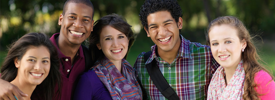 group of five teens, two males, three females, smiling